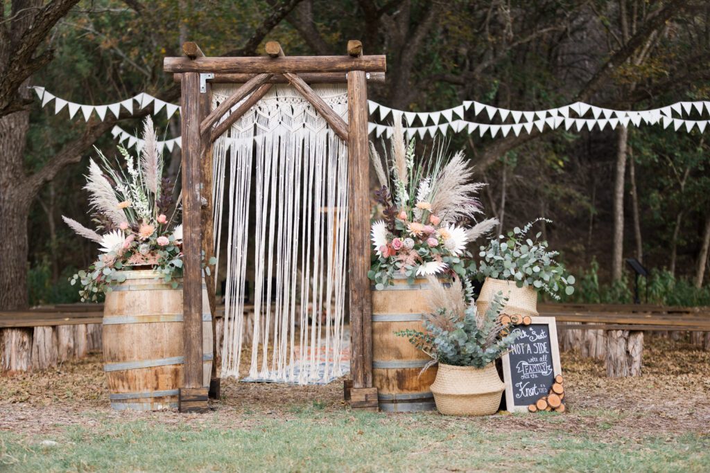 macrame and pampas grass ceremony decor at wedding