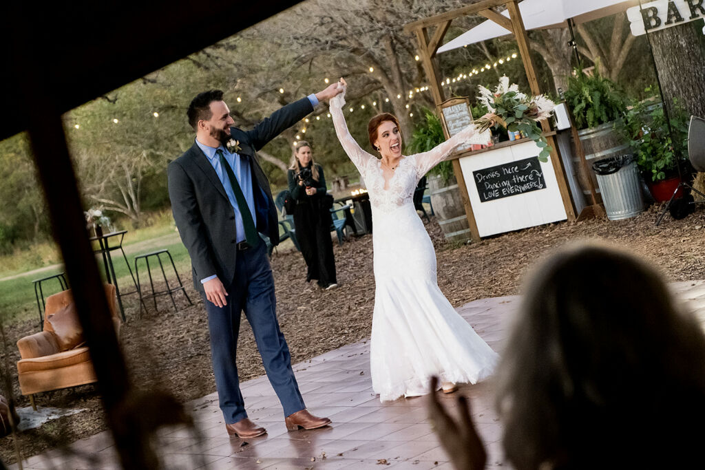 Newlyweds dance at festival style wedding venue in Texas Hill Country