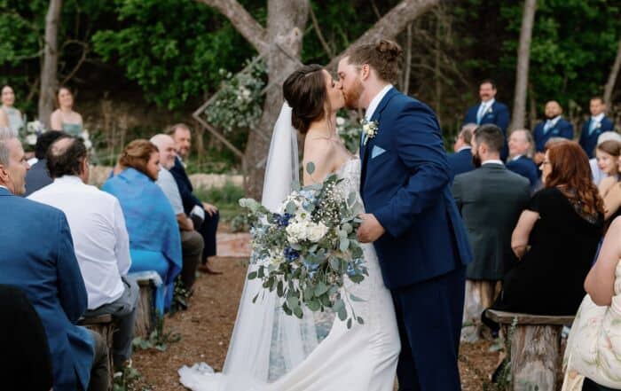 Outdoor wedding ceremony under large trees in the Texas HIll Country